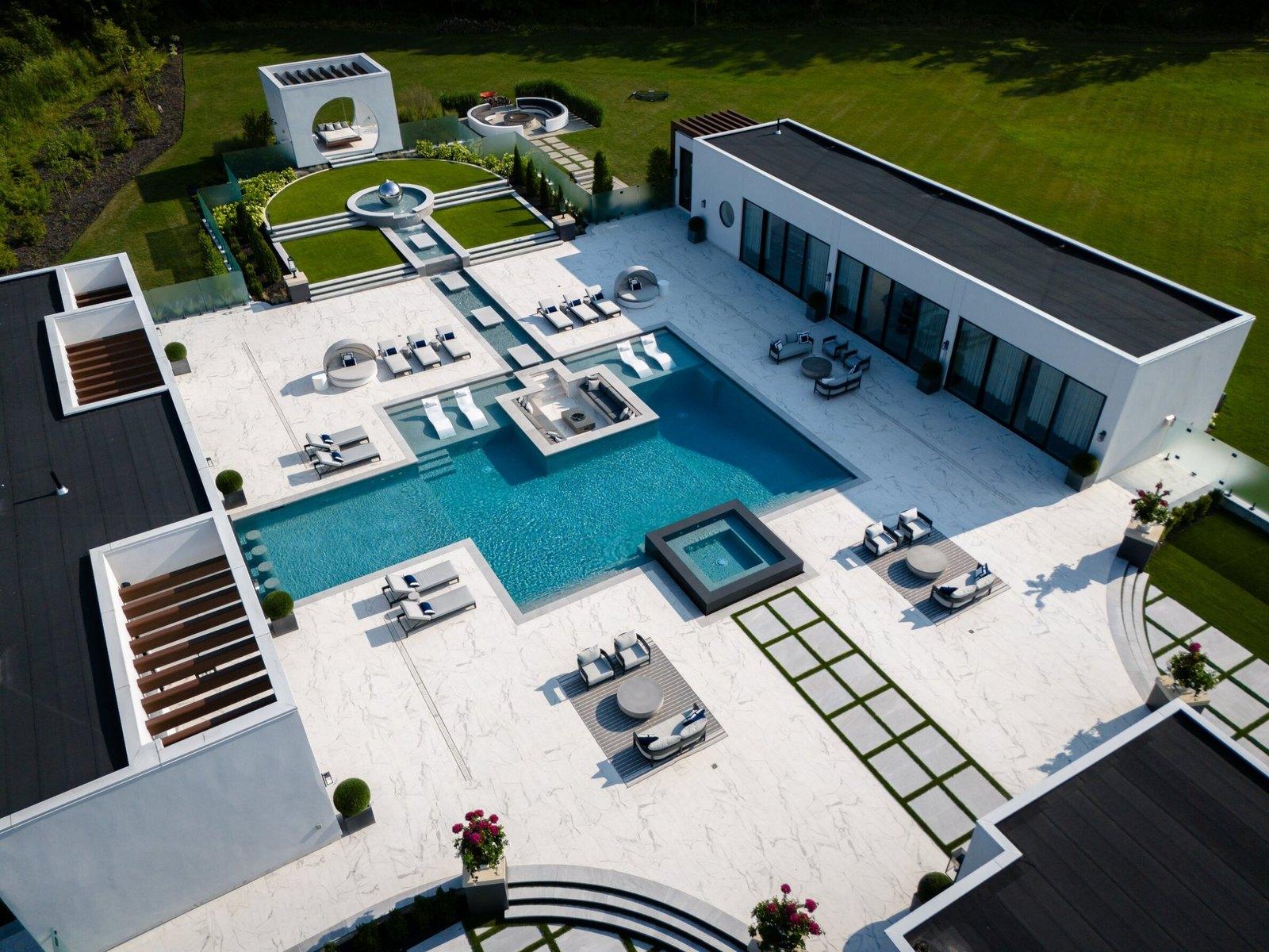 An aerial view of a Betz estate pool, spa, fountain court and pavilion